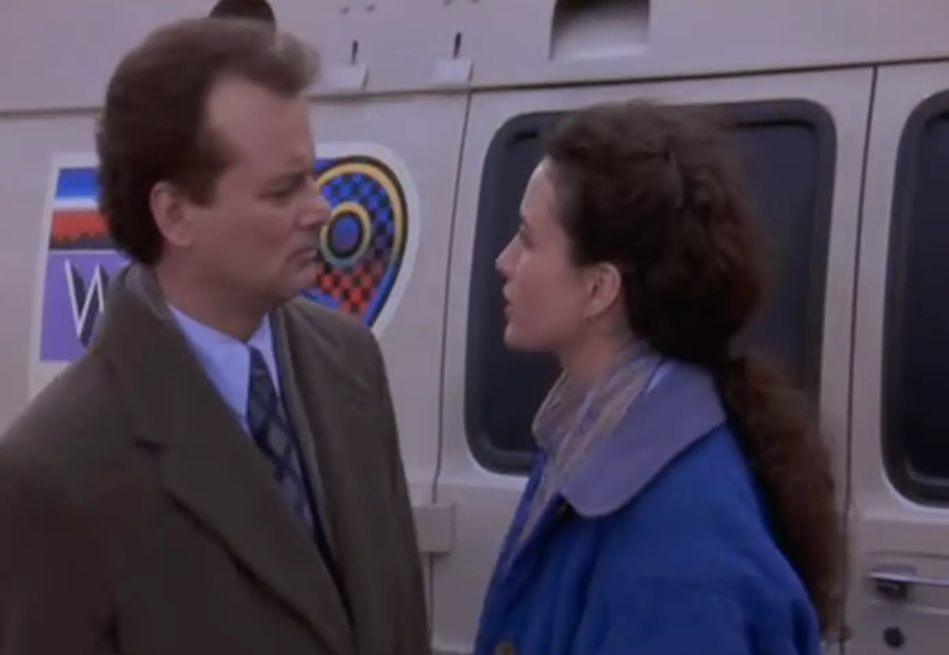 Bill Murray as Phil Connors waking up to the same morning in the film Groundhog Day, symbolizing repeated patterns and personal change.